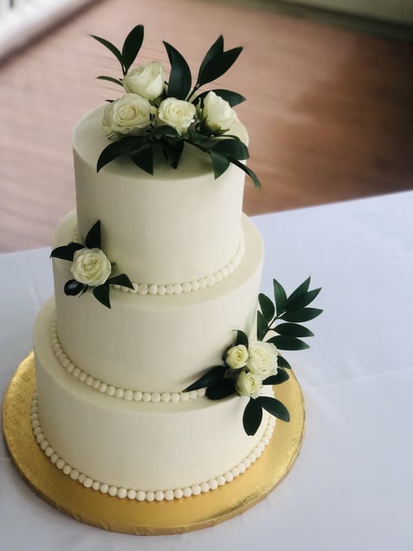Classic smooth white tiered wedding cake